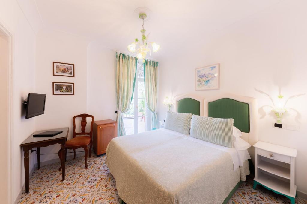 Postel nebo postele na pokoji v ubytování Hotel Giordano