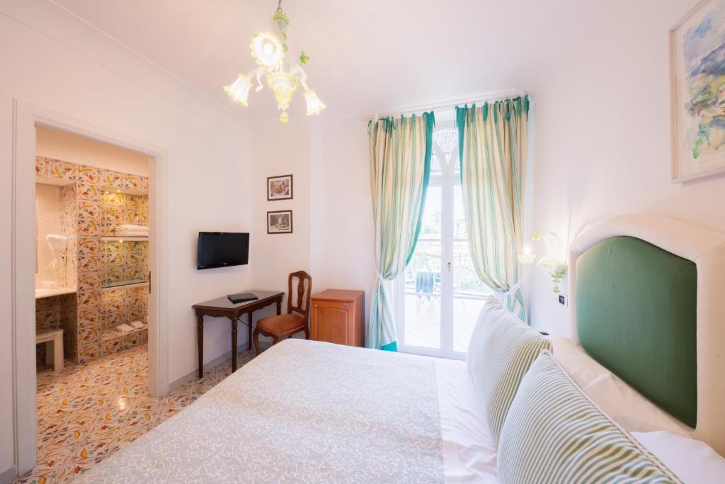 TV a/nebo společenská místnost v ubytování Hotel Giordano