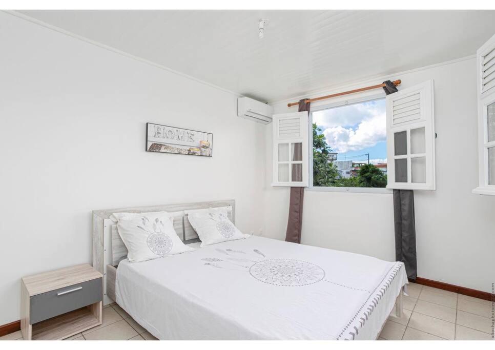 Postel nebo postele na pokoji v ubytování Anthurium, Superbe haut de villa F3 proche plage, Anse Mitan