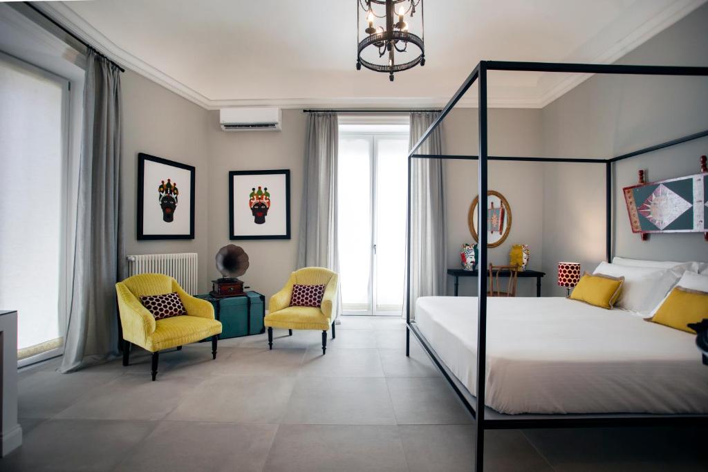 Postel nebo postele na pokoji v ubytování Vossia Luxury Rooms & Sicilian Living
