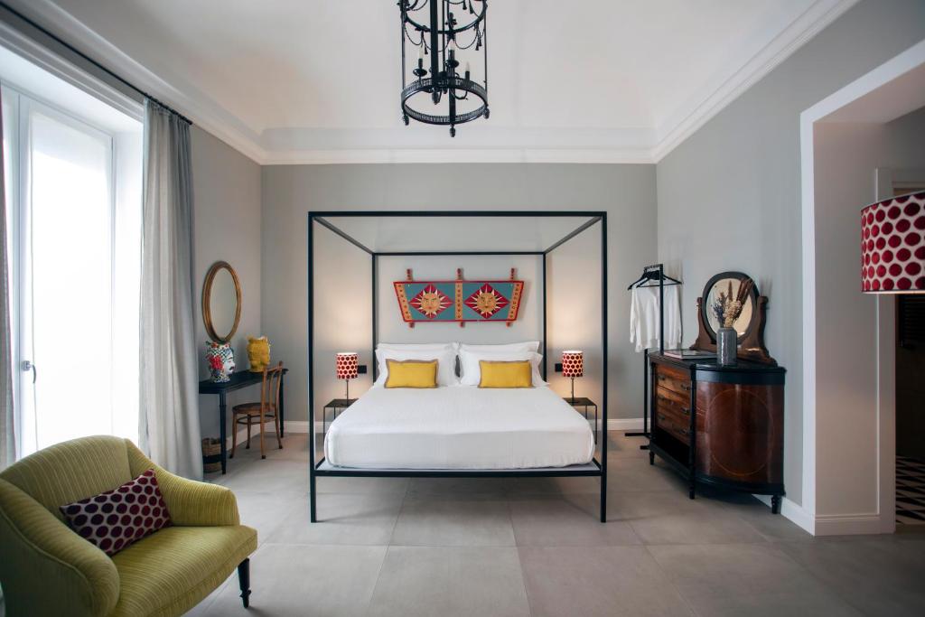 Postel nebo postele na pokoji v ubytování Vossia Luxury Rooms & Sicilian Living