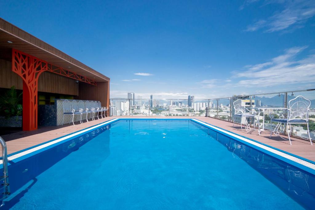 a swimming pool on the roof of a building at Hai Trieu Hotel in Da Nang