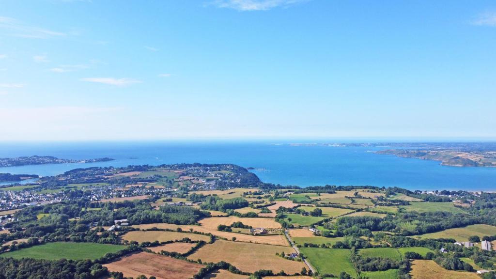 an aerial view of a city and the ocean at Lescoat-le petit paradis in Plestin-les-Grèves