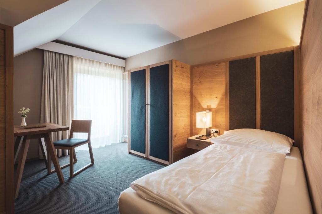 Postel nebo postele na pokoji v ubytování Hotel Arlara