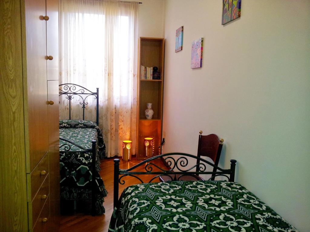 A bed or beds in a room at Assisi Casa degli Angeli