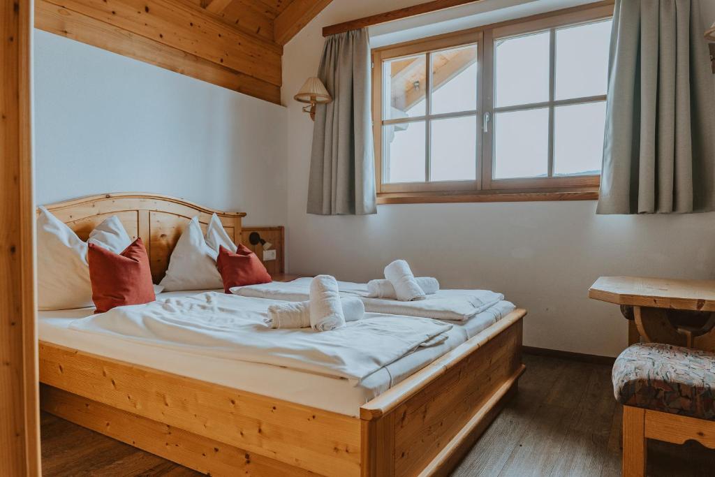 Postel nebo postele na pokoji v ubytování Reitlehenalm