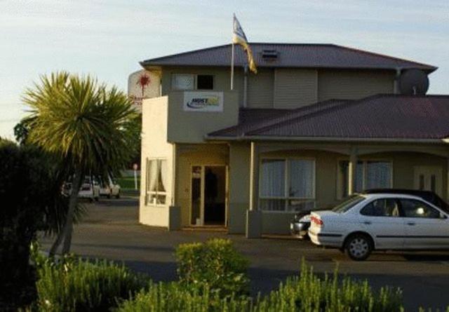 a car parked in front of a house at Shortland Court Motel in Thames