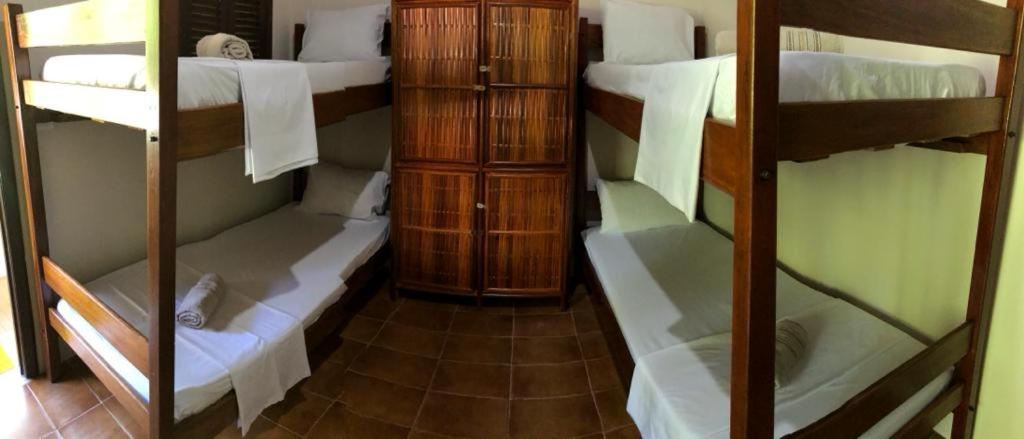 Ein Etagenbett oder Etagenbetten in einem Zimmer der Unterkunft Pousada Carpediem