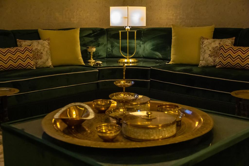 a living room with a couch and a table with candles at شاليه خاص in Riyadh