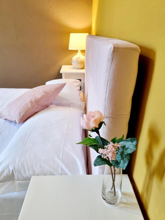 Postel nebo postele na pokoji v ubytování Rose Guest House