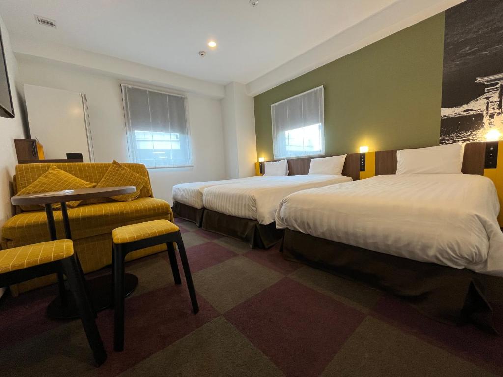Voodi või voodid majutusasutuse Henn na Hotel Tokyo Haneda toas