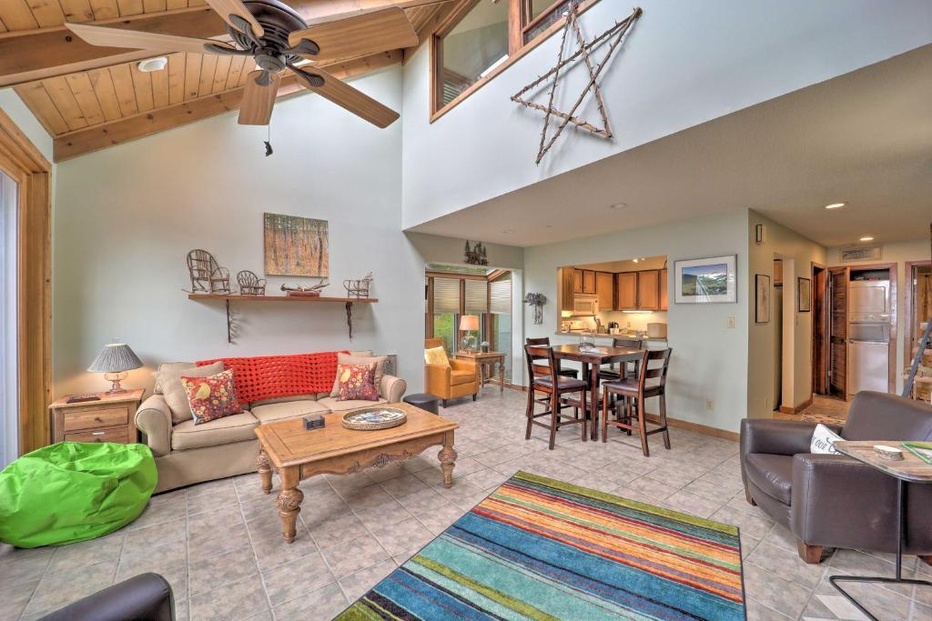 a living room with a couch and a table at All-Season Base! Unit w/ Balcony in Beech Mountain in Beech Mountain