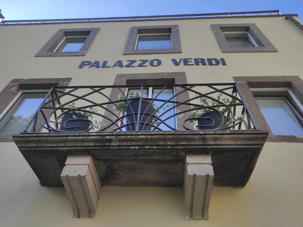 a balcony on the side of a building at Palazzo Verdi Holiday Viterbo in Viterbo