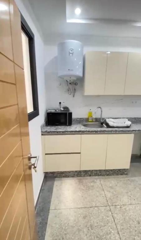 Kuchyň nebo kuchyňský kout v ubytování Résidence Bario H
