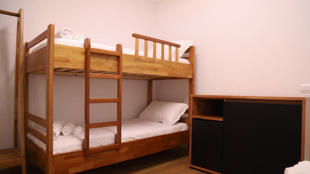 Postel nebo postele na pokoji v ubytování Bujtina Adora