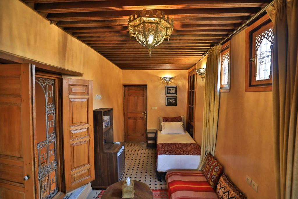 Postel nebo postele na pokoji v ubytování Riad Moulaydriss et Giacomo