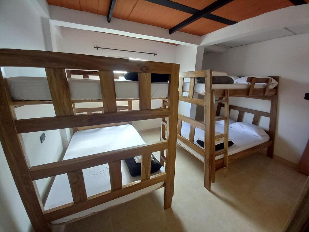 Postel nebo postele na pokoji v ubytování Ekolores Hostal - PARQUE DEL CAFÉ - 313-468-08-41