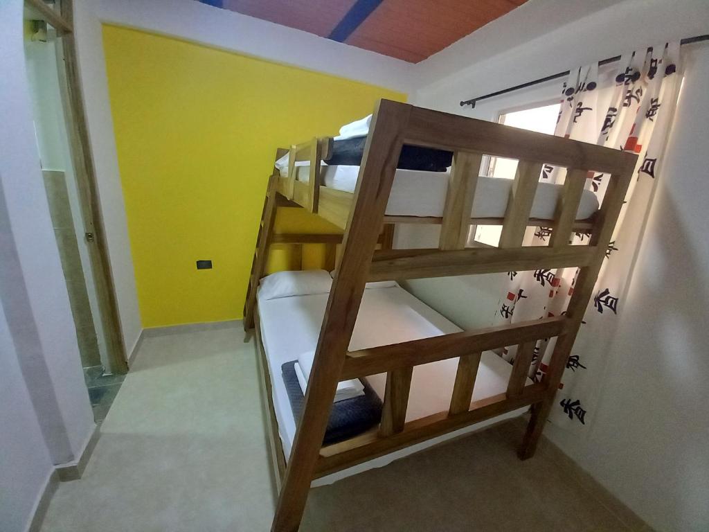 Postel nebo postele na pokoji v ubytování Ekolores Hostal - PARQUE DEL CAFÉ - 313-468-08-41