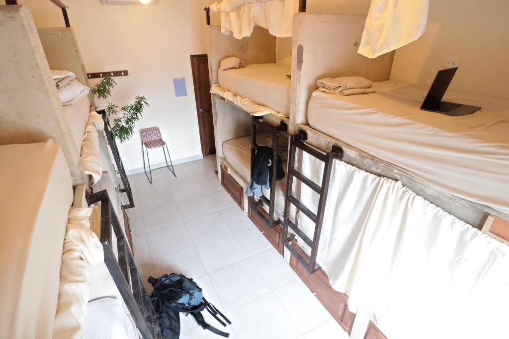 an overhead view of a dorm room with bunk beds at Distrito Hostel in Santa Marta