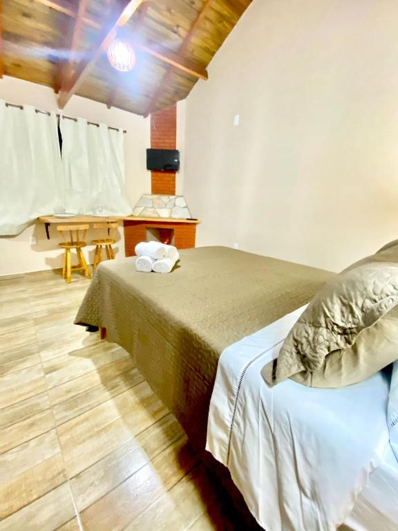 Postel nebo postele na pokoji v ubytování Chalés Campo Verde