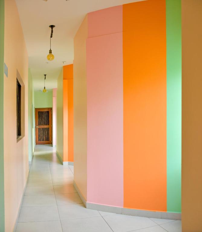a hallway with a colorful wall at Distrito Hostel in Santa Marta
