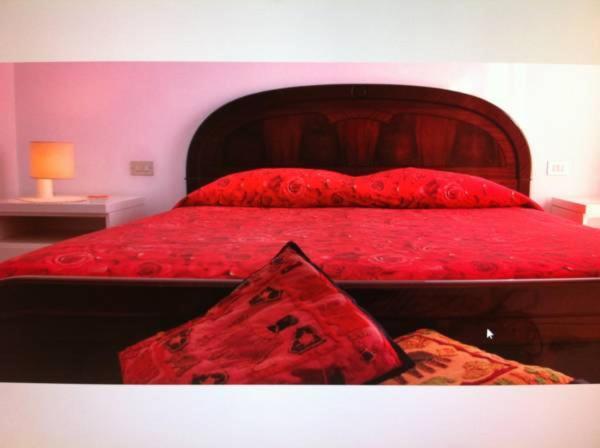 Postel nebo postele na pokoji v ubytování B&B Torre Pelosa