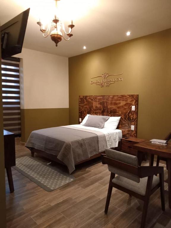 Postel nebo postele na pokoji v ubytování Casa Hidalgo