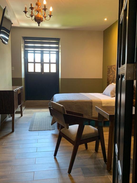 Postel nebo postele na pokoji v ubytování Casa Hidalgo