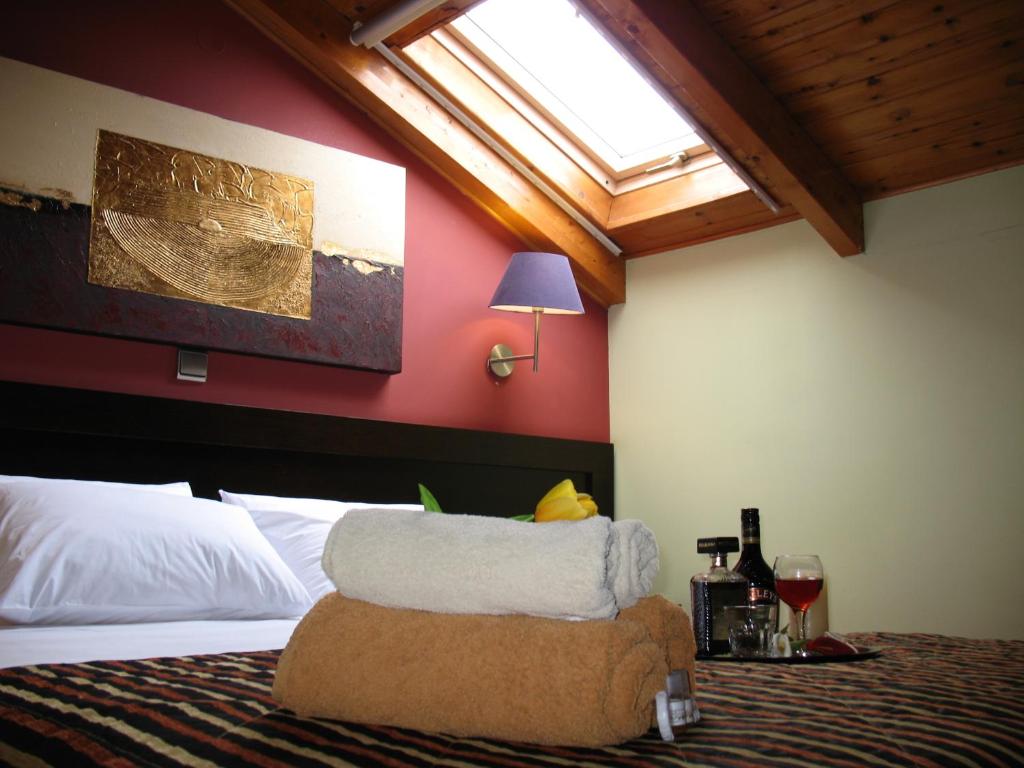 Postel nebo postele na pokoji v ubytování Hotel Prigipikon Suites and sofites