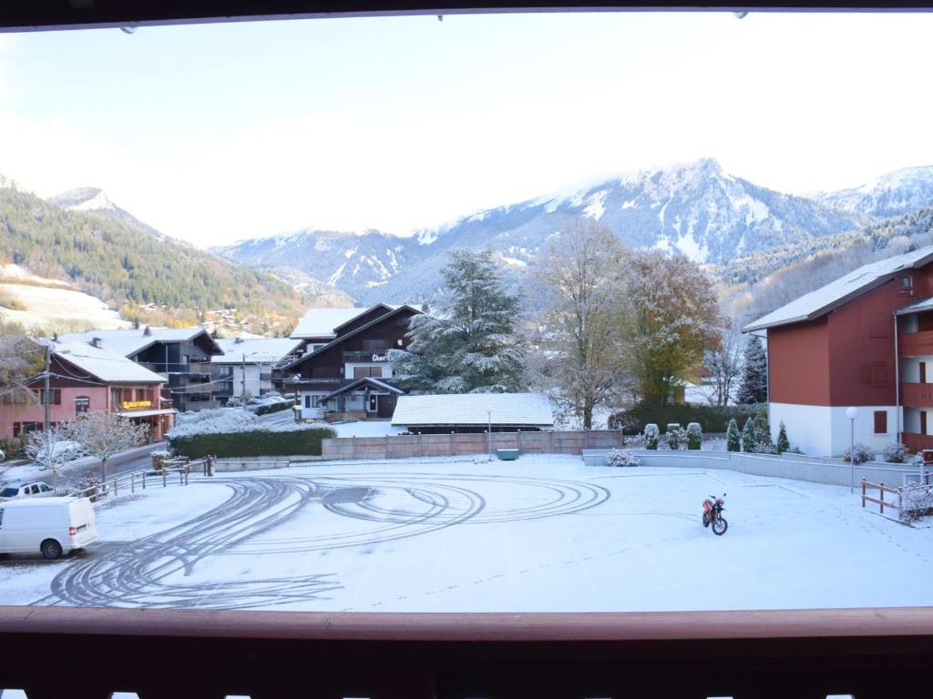 a person riding a bike on a snow covered street at Studio Bernex, 1 pièce, 4 personnes - FR-1-498-36 in Bernex