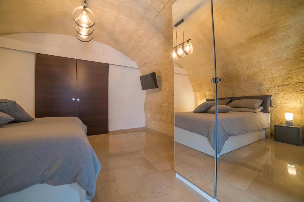 Postel nebo postele na pokoji v ubytování A due passi dal mare