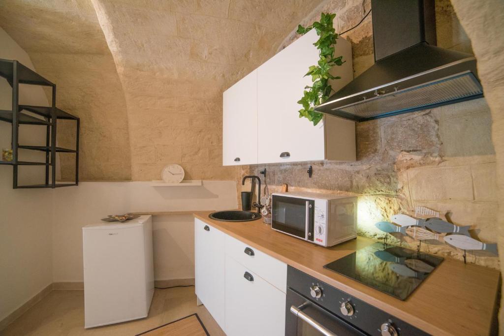 Kuchyň nebo kuchyňský kout v ubytování A due passi dal mare