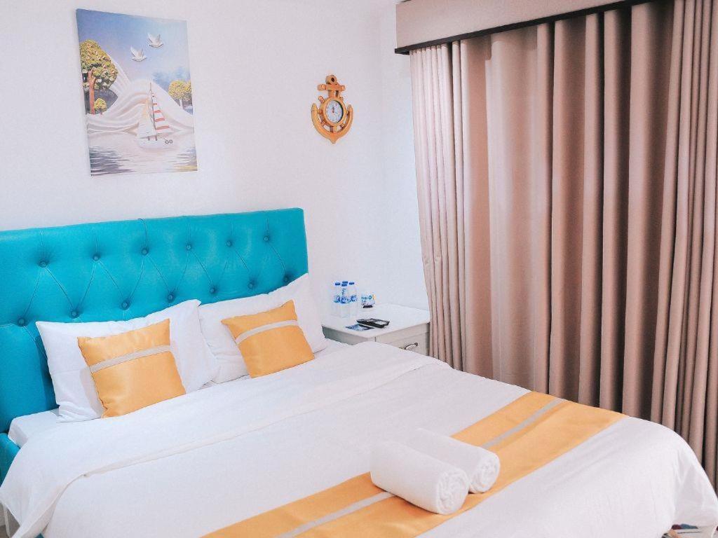 Postel nebo postele na pokoji v ubytování Villa Excellance Beach and Wave Pool Resort