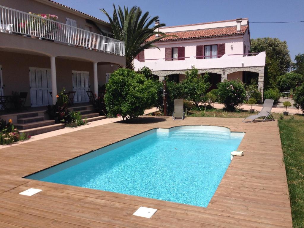 a swimming pool in front of a house at I Casilari in Serra-di-Ferro