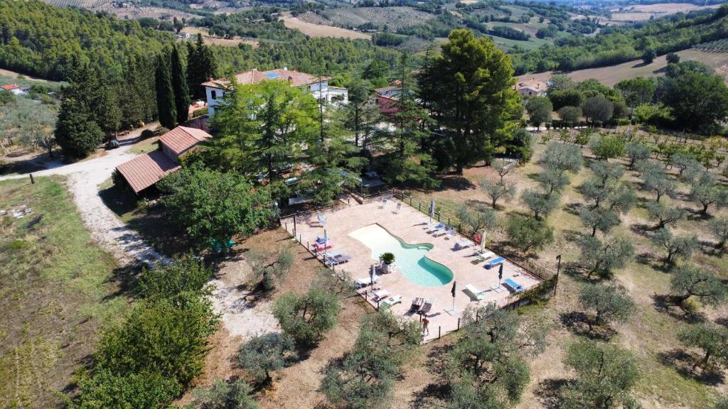 an aerial view of a swimming pool on a hill at Casale Fusco in Spoleto