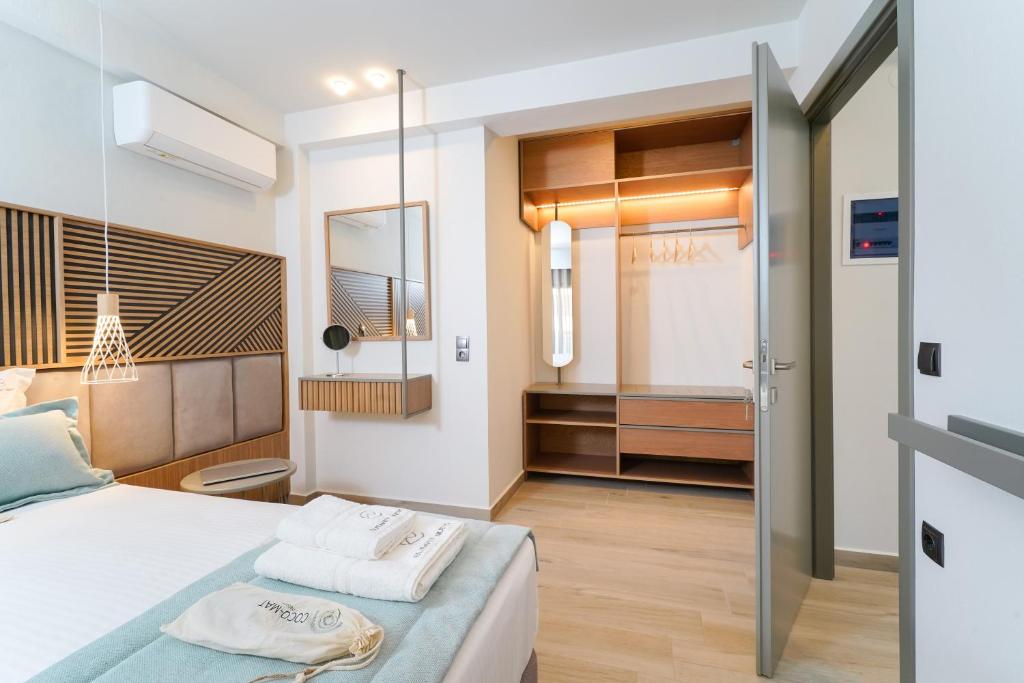 Postel nebo postele na pokoji v ubytování Elisavet Nuevo Studios & Suites