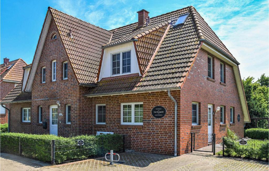 a large red brick house with a roof at Seestern in Gollwitz