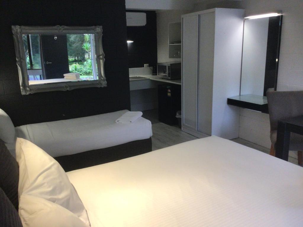 Postel nebo postele na pokoji v ubytování Buderim Fiesta Motel