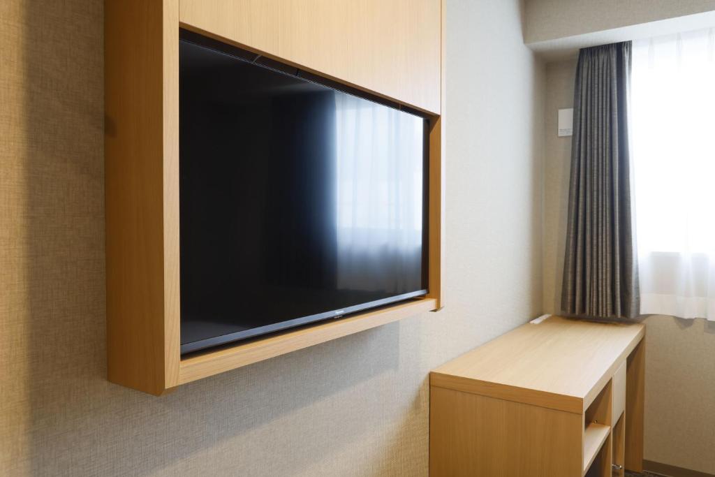 TV a/nebo společenská místnost v ubytování Plum Hotel
