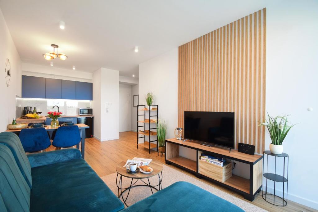 Televízia a/alebo spoločenská miestnosť v ubytovaní WESTIN HOUSE RESORT Apartament 215