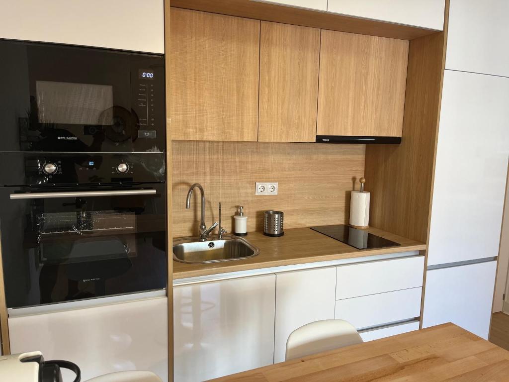 Kuchyň nebo kuchyňský kout v ubytování Wonderful Loft, parking free V