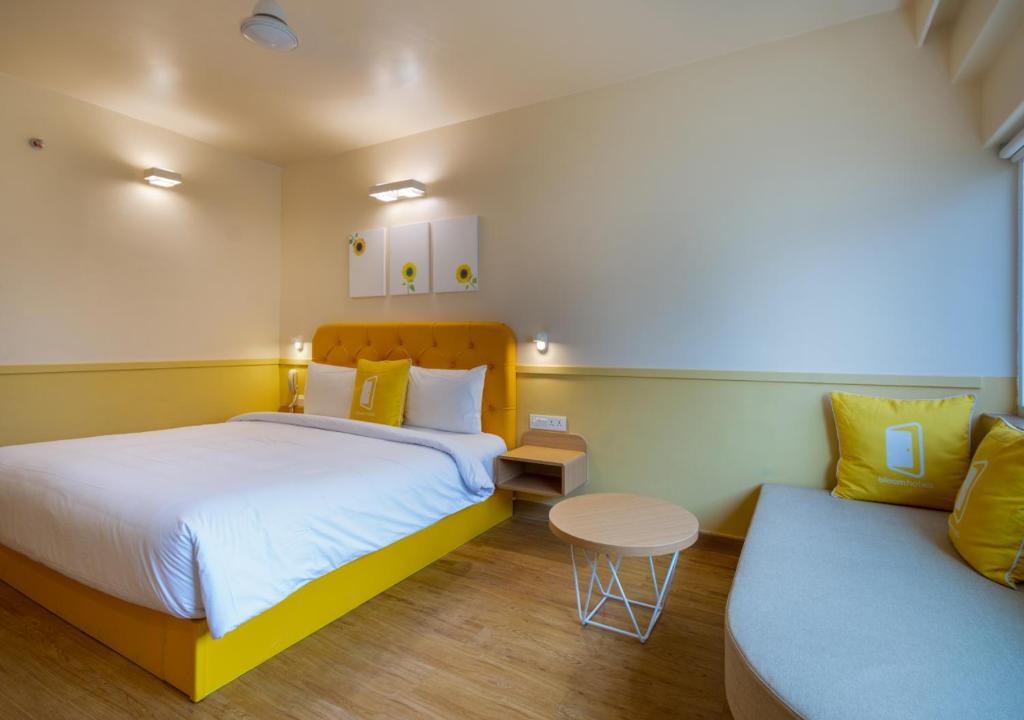 Postel nebo postele na pokoji v ubytování Bloom Hotel - HITEC City