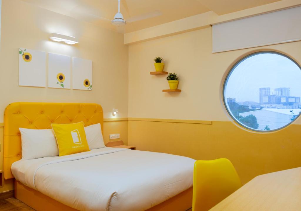 Postel nebo postele na pokoji v ubytování Bloom Hotel - HITEC City