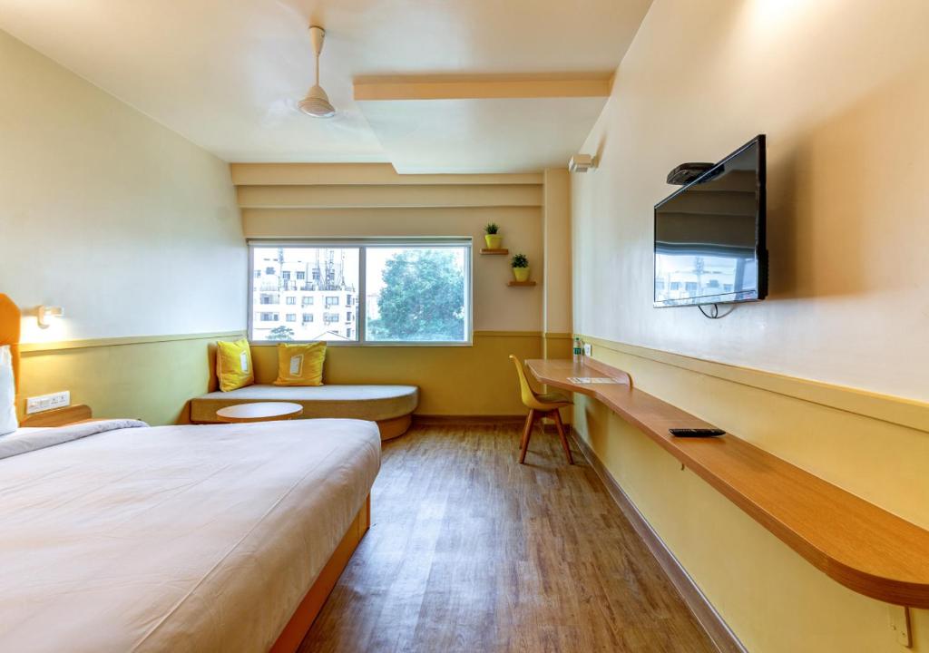 Postel nebo postele na pokoji v ubytování Bloom Hotel - HITEC City