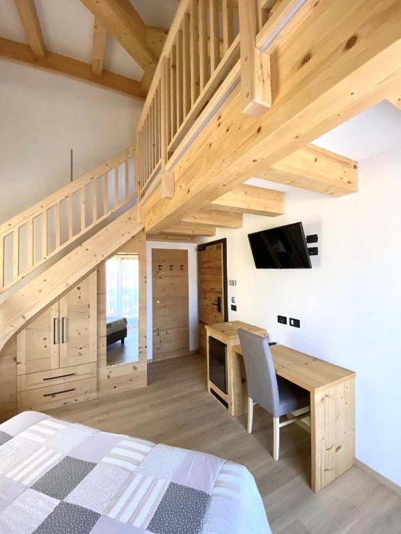 TV a/nebo společenská místnost v ubytování Hotel Chalet Alaska