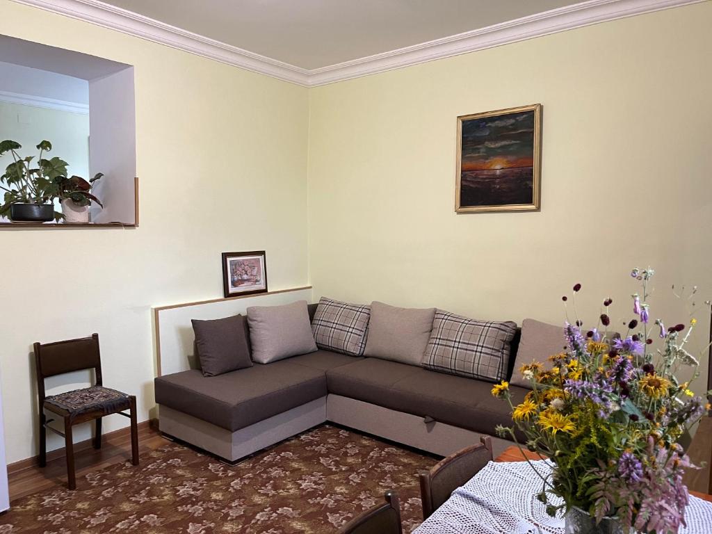 a living room with a couch and a chair at Inexpensive house in Vanadzor