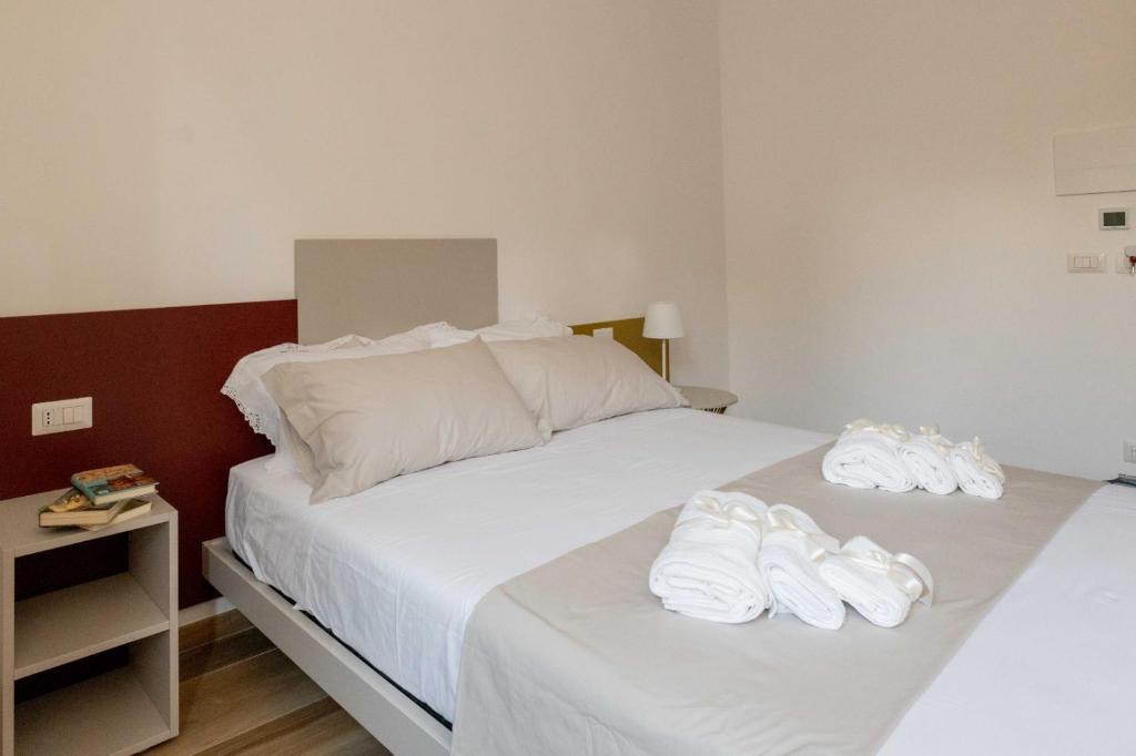 Postel nebo postele na pokoji v ubytování Dimora Tolosa