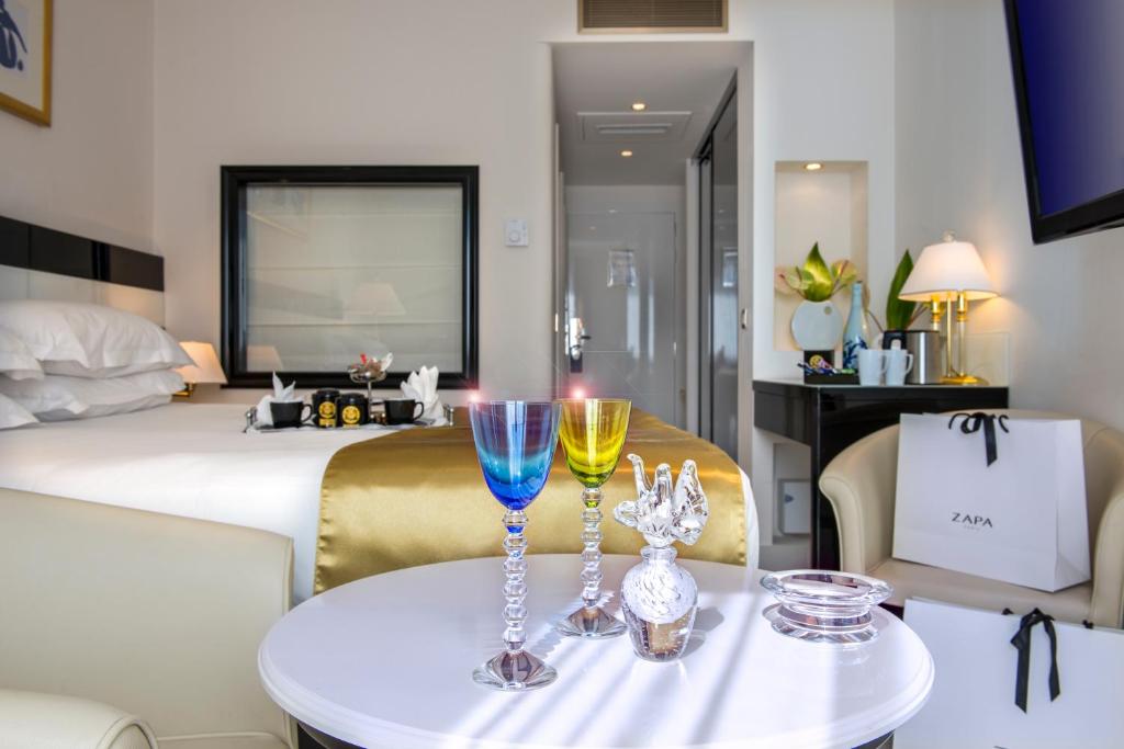 Postel nebo postele na pokoji v ubytování Hotel Aston La Scala