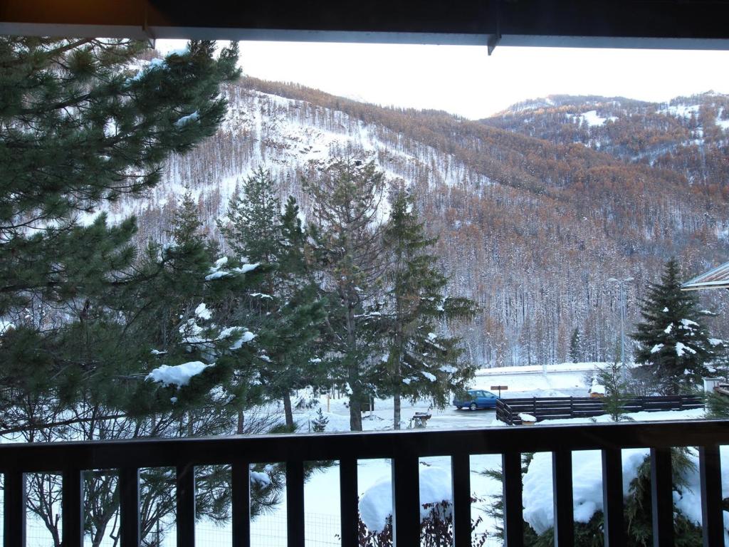 a view of a snow covered mountain from a balcony at Appartement Saint-Chaffrey , 3 pièces, 6 personnes - FR-1-330E-106 in Saint-Chaffrey