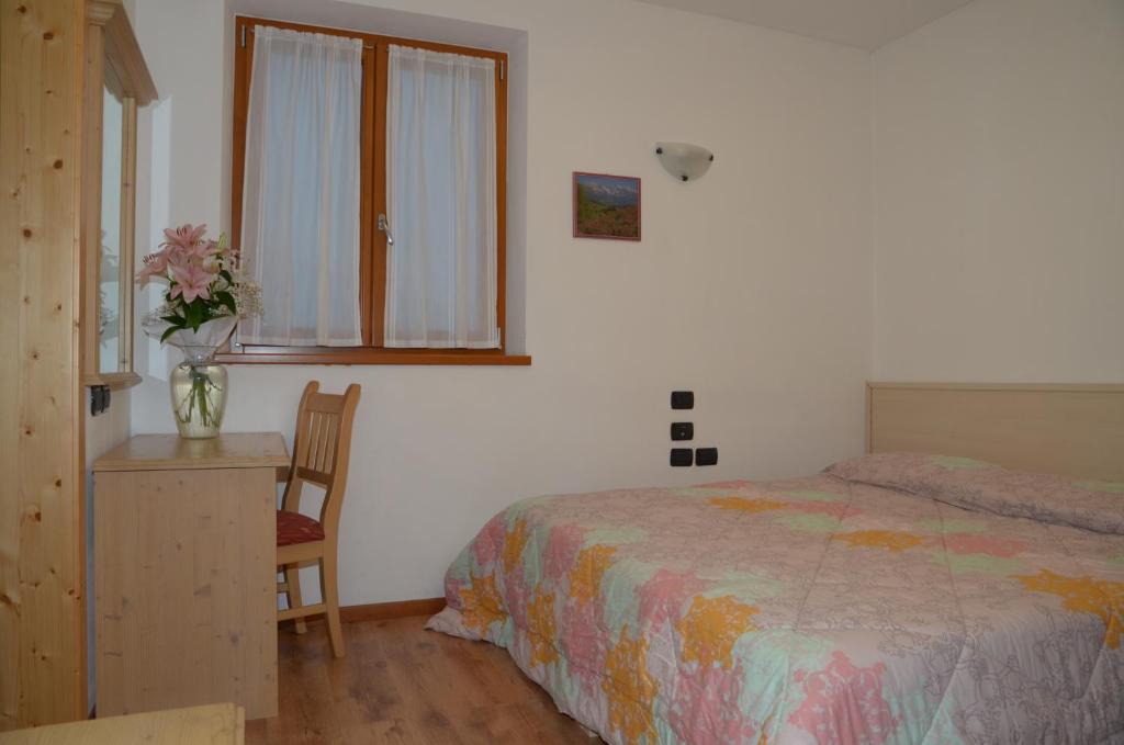 Postel nebo postele na pokoji v ubytování Agritur Girardelli